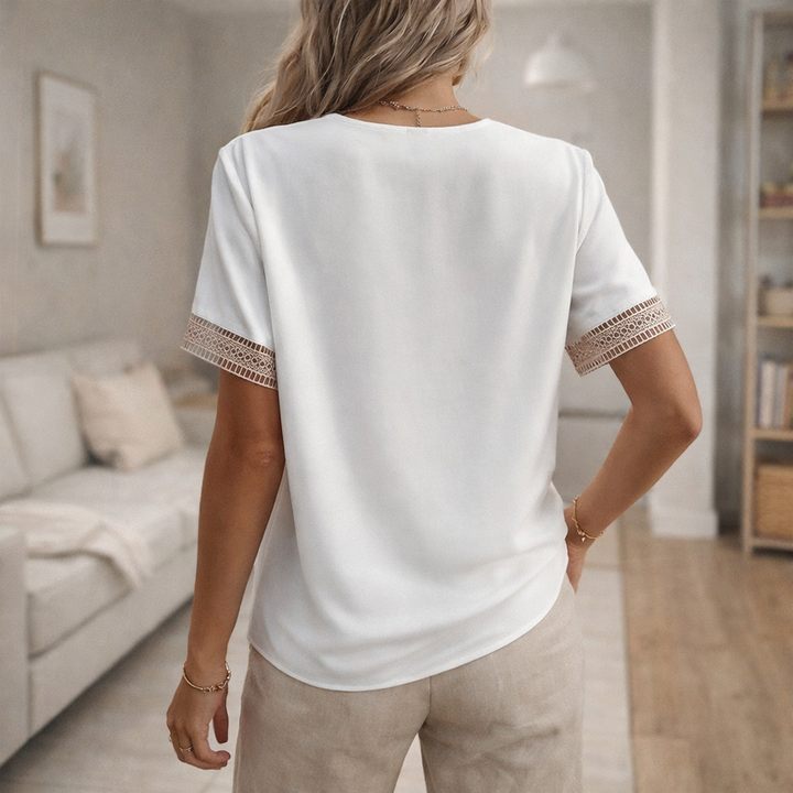 Chic women's V-neck blouse with lace trim, ideal for elegant casual wear and feminine everyday style.