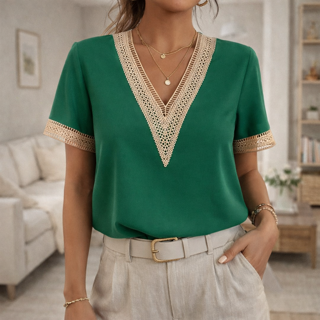 Feminine women's V-neck blouse with intricate lace trim and short sleeves for comfortable spring/summer fashion.
