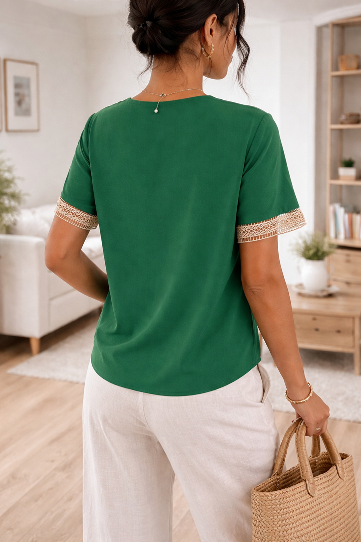 Stylish women's V-neck top featuring elegant lace trim, short sleeves, and a relaxed fit for daily wear.