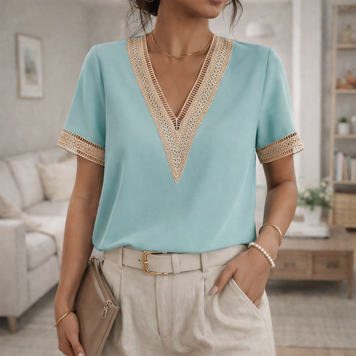Women's short sleeve V-neck blouse with elegant lace trim, offering a relaxed fit for chic casual style.