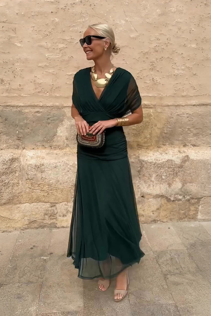 Women's elegant V-neck maxi dress with flutter sleeves & pleated waist. Perfect for formal events.