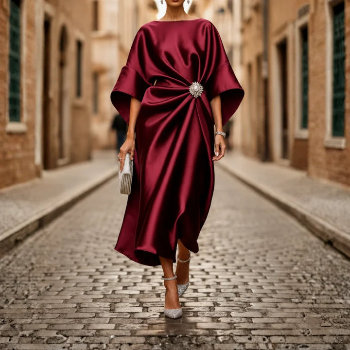 Comfortable women's V-neck midi dress, featuring a flowy flared skirt and elbow sleeves.
