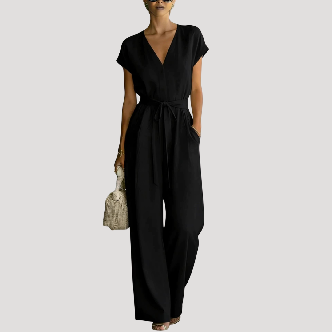 Stylish women's V-neck jumpsuit featuring a flattering tie waist and flowing wide legs for summer comfort.