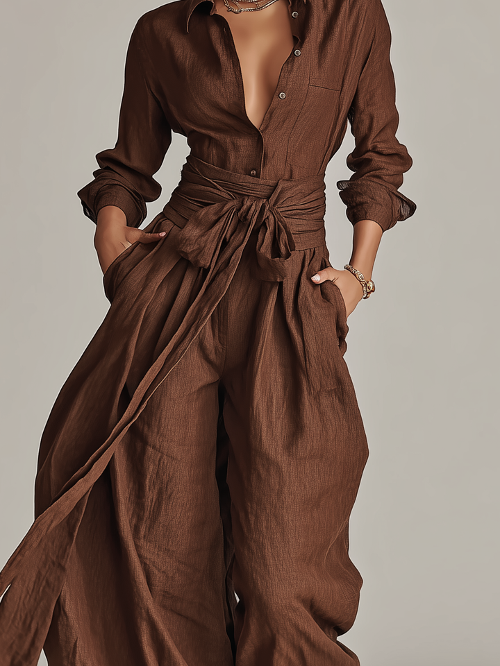 Flowy wide leg jumpsuit with a flattering tie waist, women's fashion for elegant summer or resort wear.