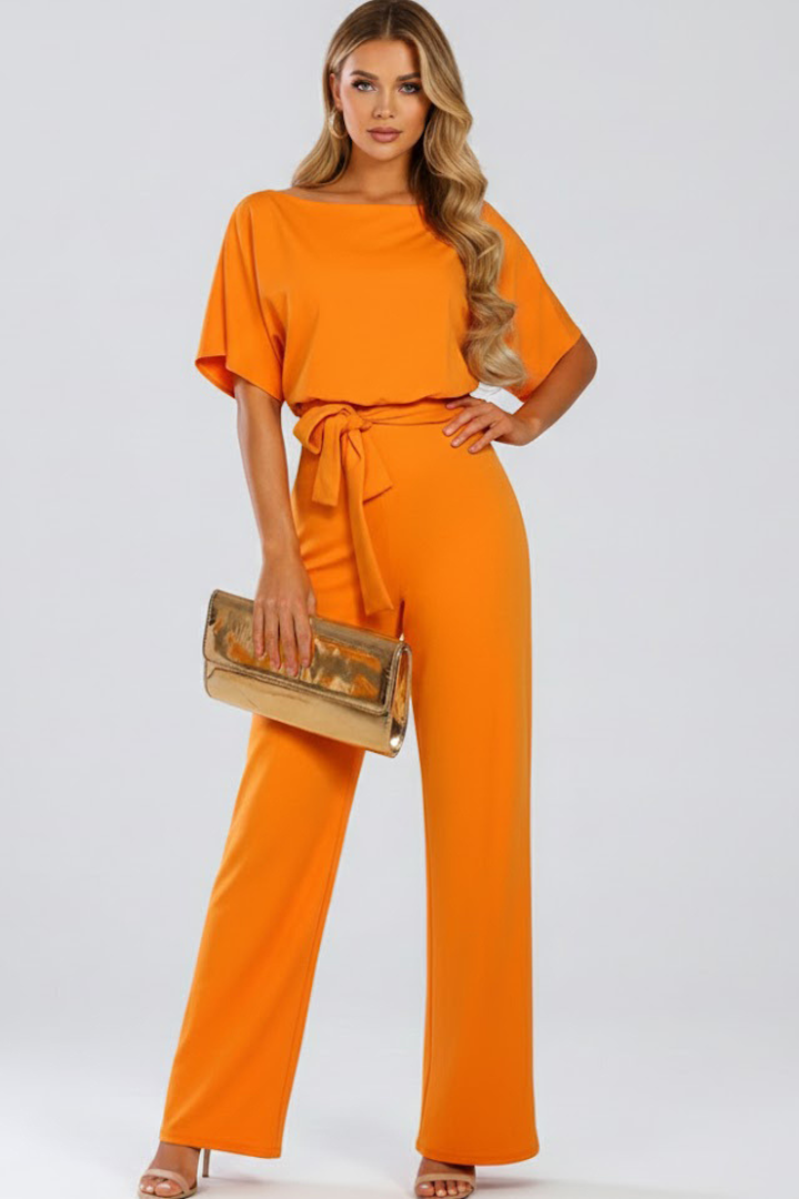 Fashionable women's wide leg short sleeve jumpsuit. Enjoy comfort & style with its elegant design and belt.