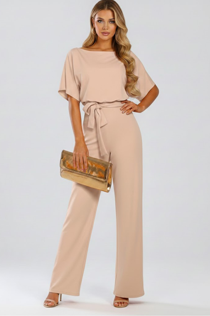 Chic women's wide leg short sleeve jumpsuit featuring a round neck & stylish tie-waist belt. Versatile summer wear.