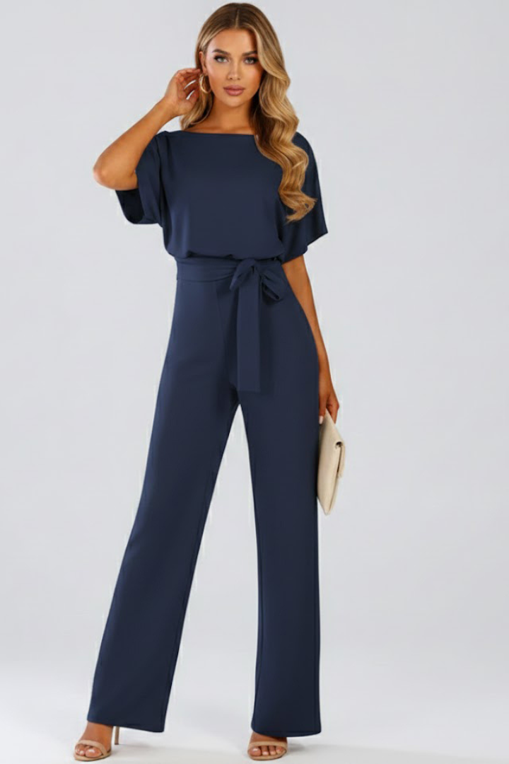 Women's short sleeve wide leg jumpsuit with a sophisticated belt. Ideal for summer elegance & casual chic style.