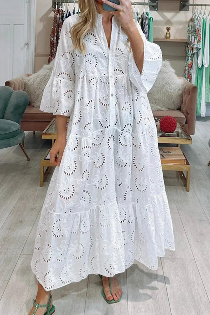 Women's embroidered boho flowy maxi dress, perfect for summer elegance & vacation wear.