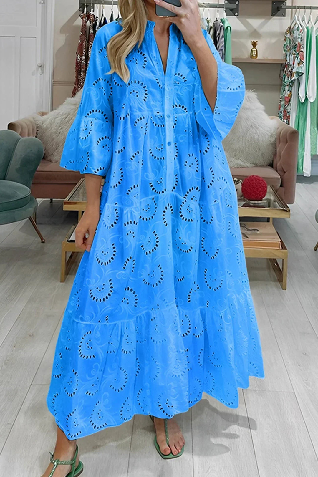Stylish women's embroidered maxi dress with a V-neck, perfect for elegant resort wear.