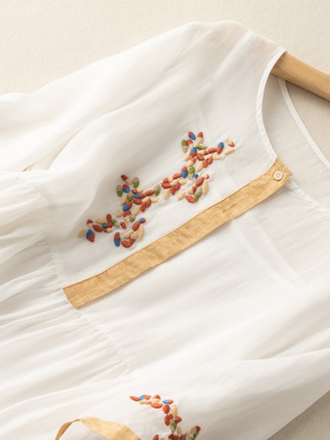 Green embroidered boho dress, a versatile women's midi with a relaxed fit & round neck. Ideal for summer style.