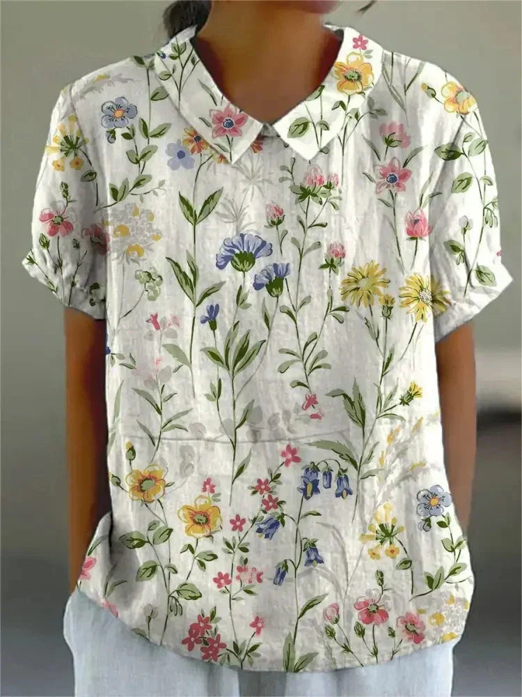 Vintage style women's floral embroidered short sleeve blouse, a breathable summer top for elegant casual chic.