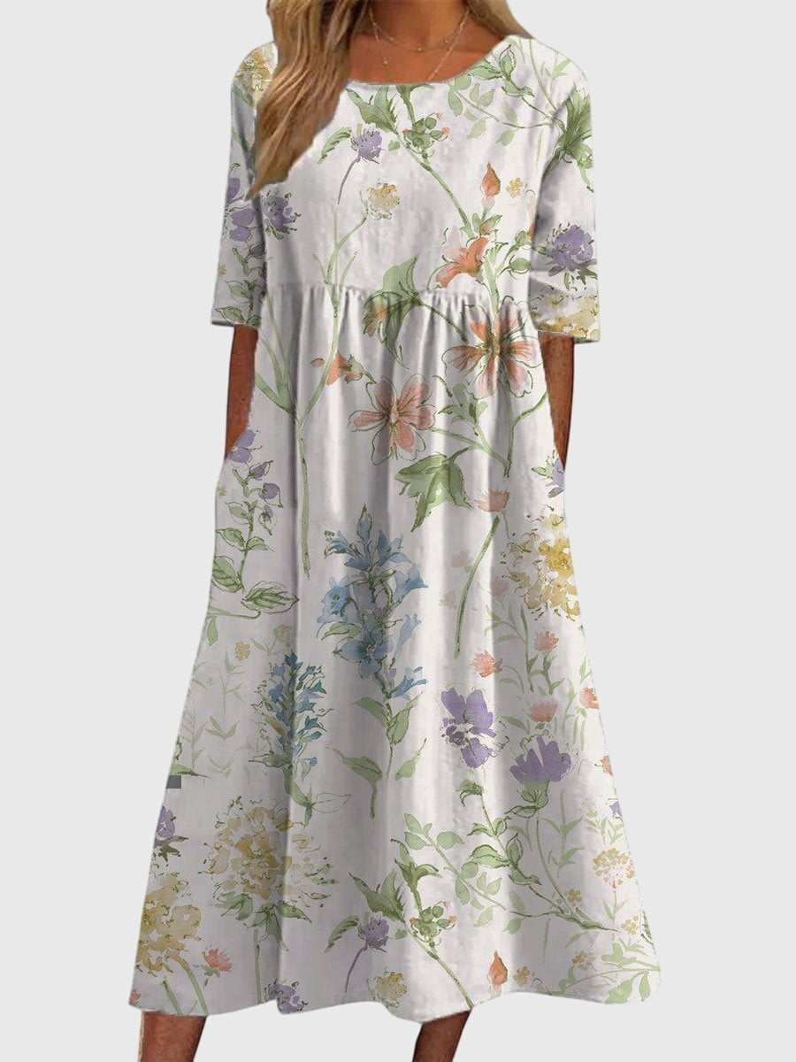 Back view of a women's versatile embroidered midi dress, offering effortless elegance and comfort for any occasion.