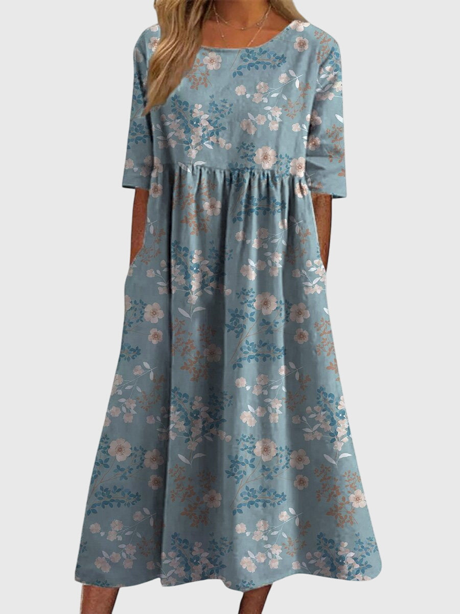 Soft, comfortable women's embroidered midi dress with a relaxed, flowy fit; ideal for elegant summer events.