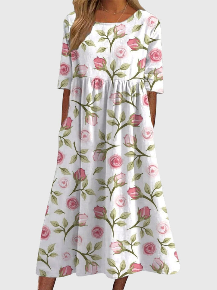 Effortless elegance in a women's embroidered flowy midi dress; comfortable, versatile, and perfect for summer fashion.