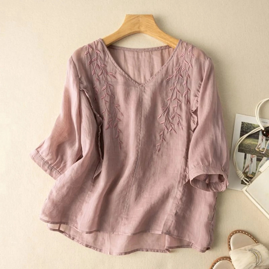 Boho chic women's blouse with intricate embroidery, made from comfortable linen blend fabric