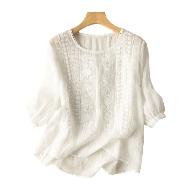Women's embroidered puff sleeve blouse, a stylish & flowy top with floral details. Perfect for spring/summer.