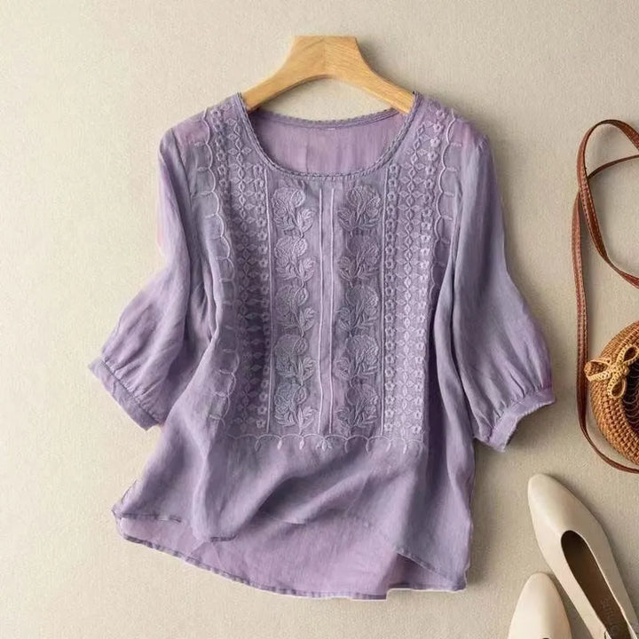Comfortable women's puff sleeve blouse with intricate embroidery & a stylish loose fit. Ideal for women's fashion.