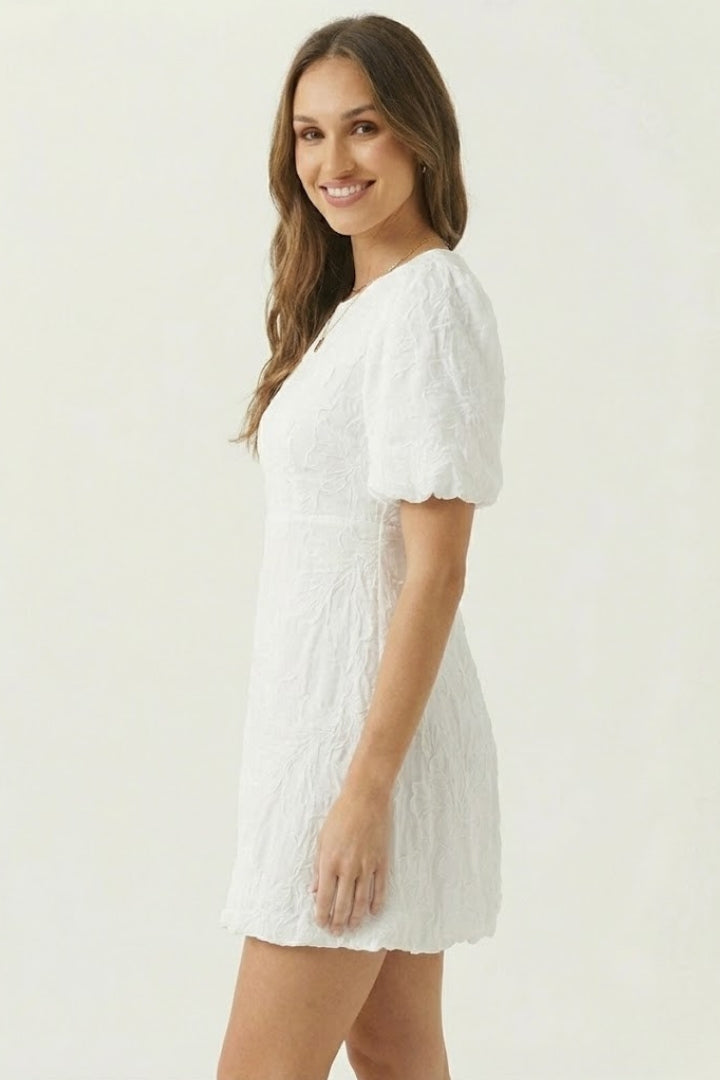 Soft women's summer mini dress with detailed floral embroidery, comfortable puff sleeves, and a trendy V-neck.