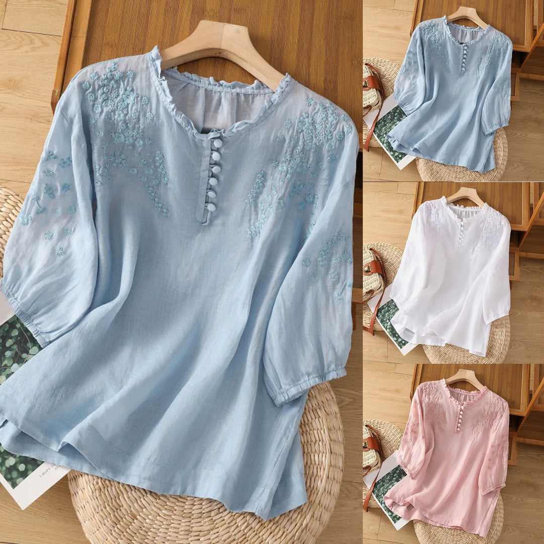 Chic women's embroidered short sleeve blouse with button neck. Relaxed fit top, versatile for spring & summer outfits.