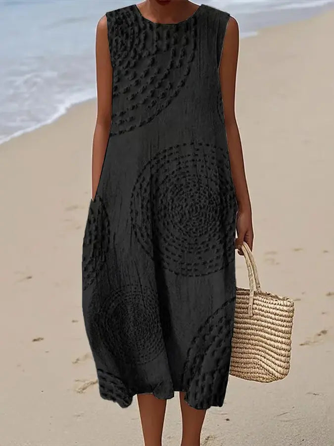 Flattering A-line women's sleeveless midi dress. Embroidered floral pattern, practical side pockets. Perfect casual summer wear.