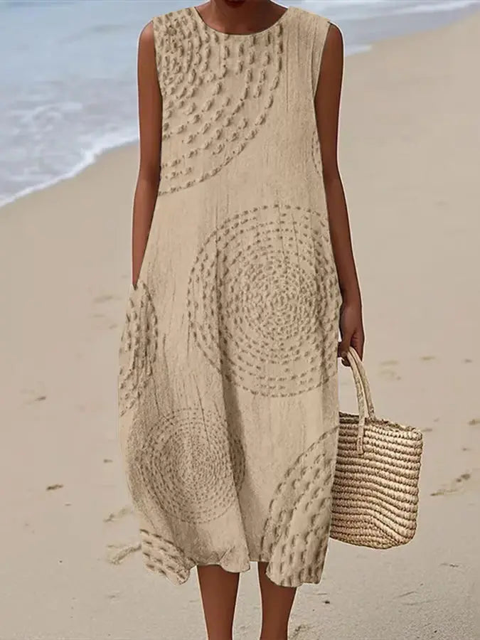 Comfortable women's round neck sleeveless midi dress, featuring intricate floral embroidery & a flattering A-line fit. Day/resort wear.