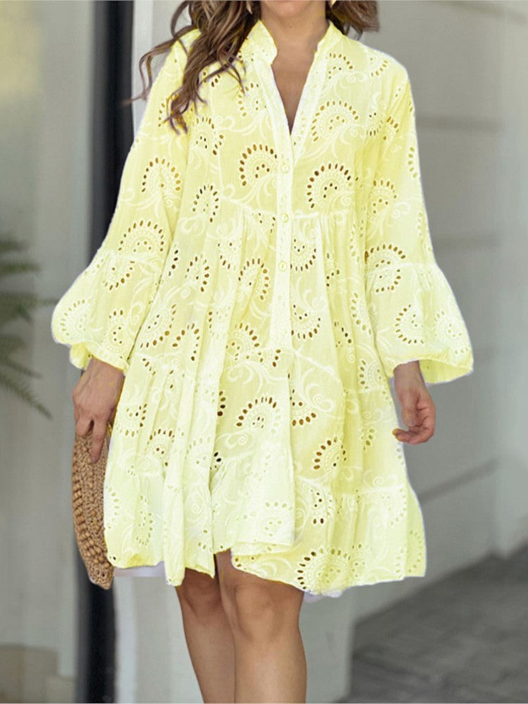 Women's boho mini dress, embroidered, tiered design, V-neck, and button-front details.