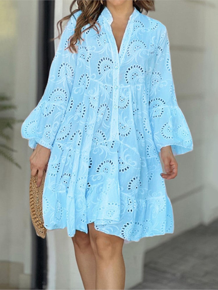 Elegant women's tiered mini dress with intricate eyelet embroidery, V-neck, and flared sleeves.