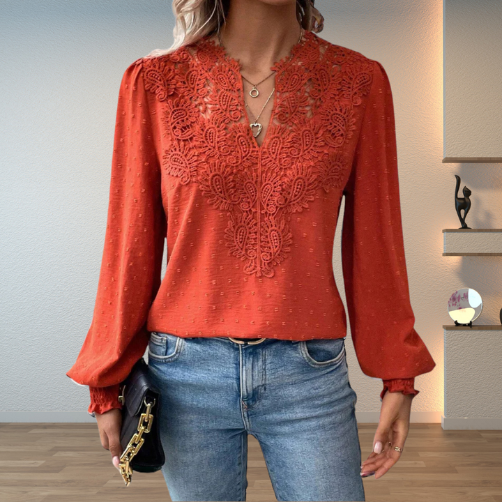Women's embroidered V-neck long sleeve blouse, versatile for elegant or casual womenswear.