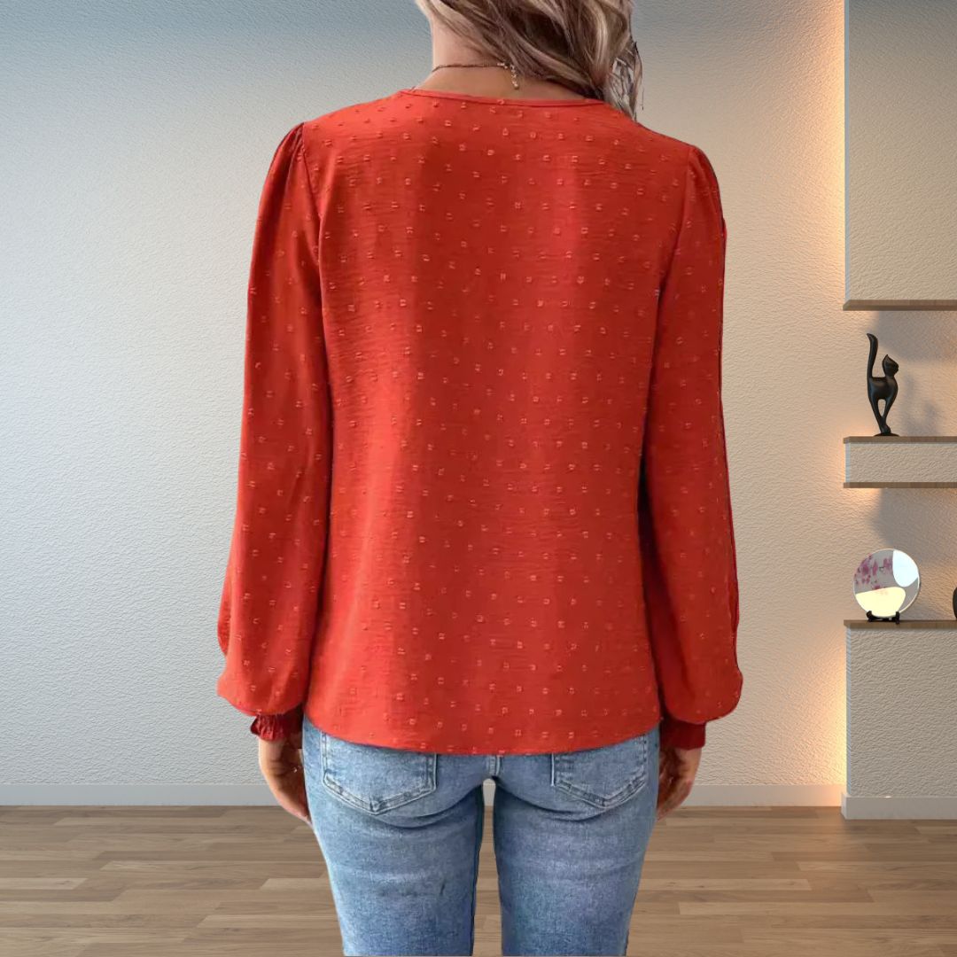 Stylish women's embroidered V-neck blouse with puff long sleeves, perfect for daily fashion.