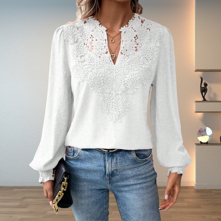 Casual women's V-neck top with intricate embroidery and long sleeves for a chic look.