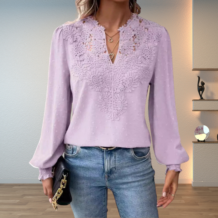 Trendy women's long sleeve V-neck blouse featuring beautiful embroidery and a casual fit.