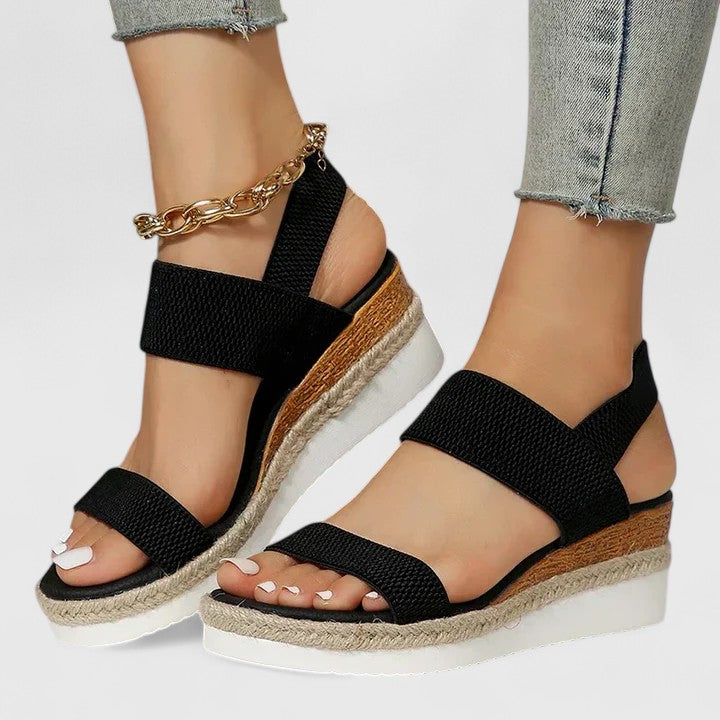 Chic women's slip-on espadrille wedge sandals featuring elastic straps and an open toe design.