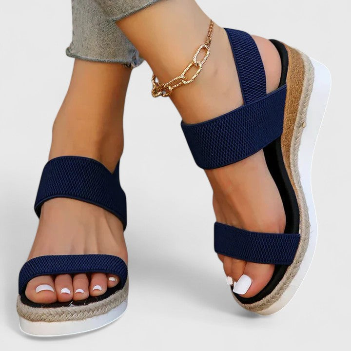 Fashionable women's espadrille wedge sandals with elastic straps, designed for casual summer wear.