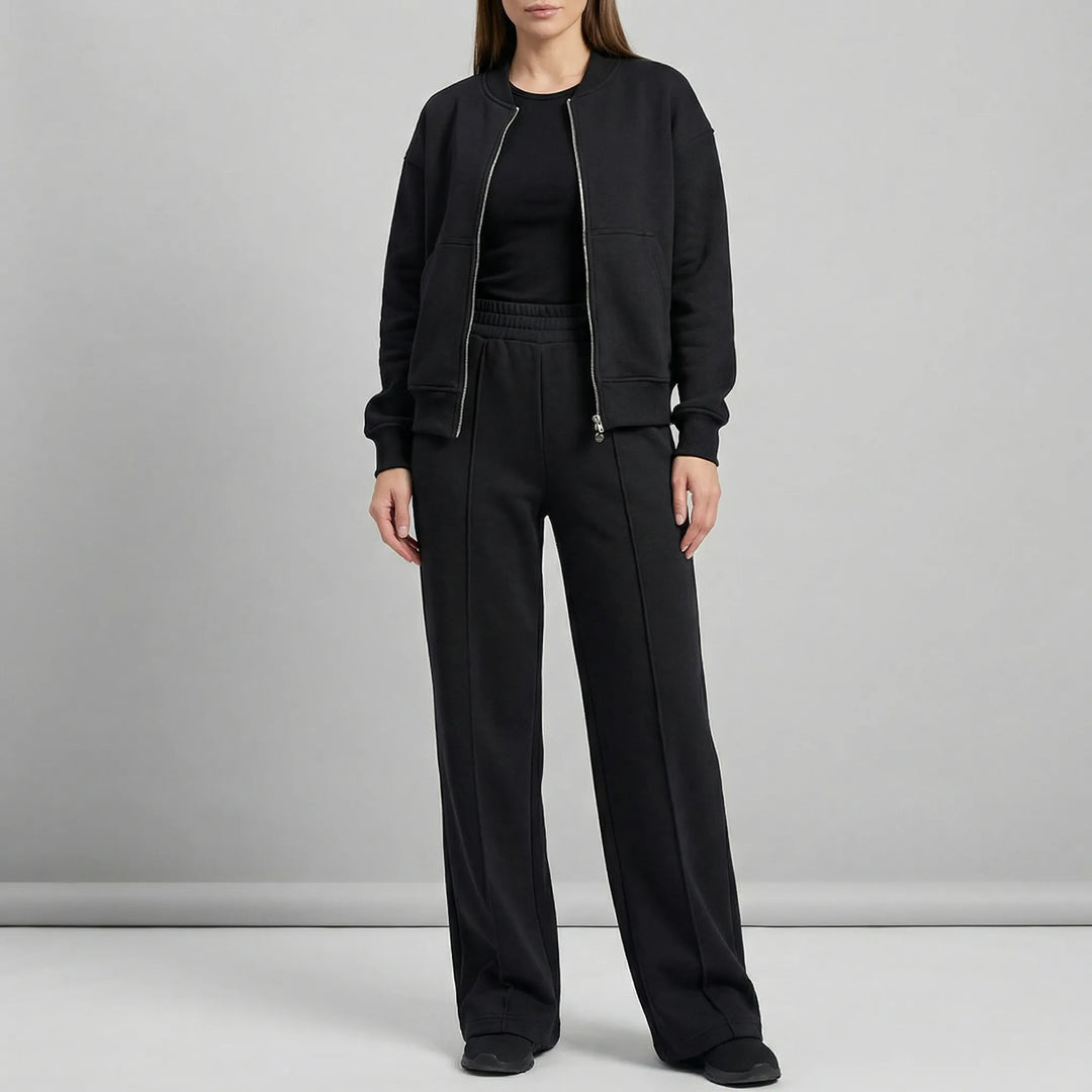 Elegant women's two-piece outfit featuring straight leg trousers & jacket. Coordinated look.
