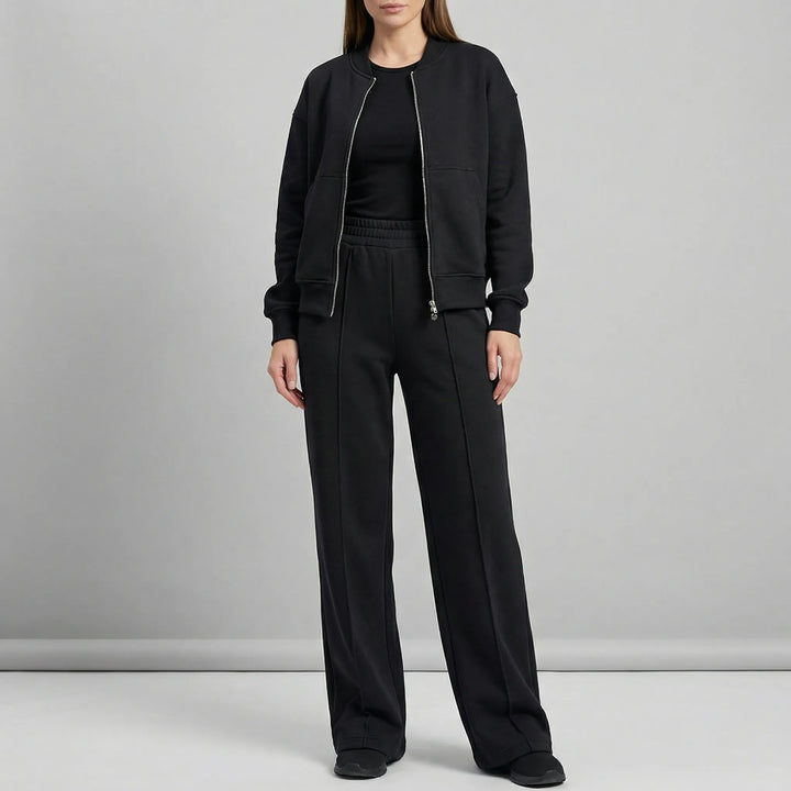 Elegant women's two-piece outfit featuring straight leg trousers & jacket. Coordinated look.
