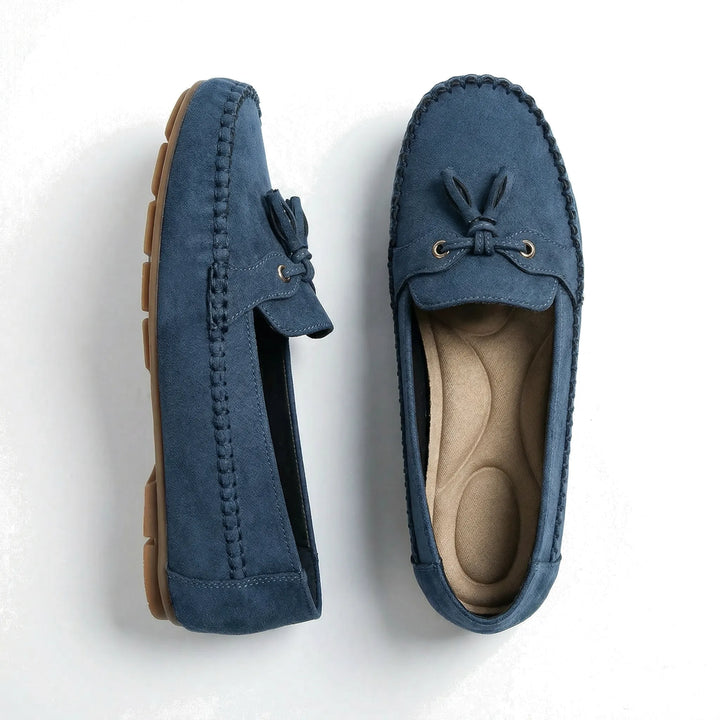 Woman showcasing extra wide memory foam loafers, perfect for comfortable casual style.