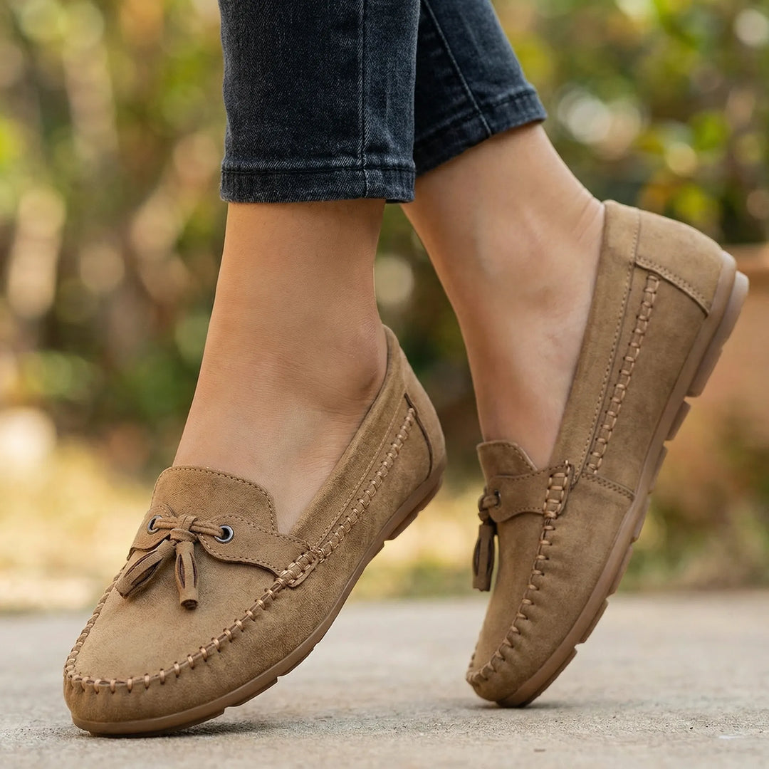 Pair of women's extra wide slip-on loafers, versatile classic style for everyday comfort.