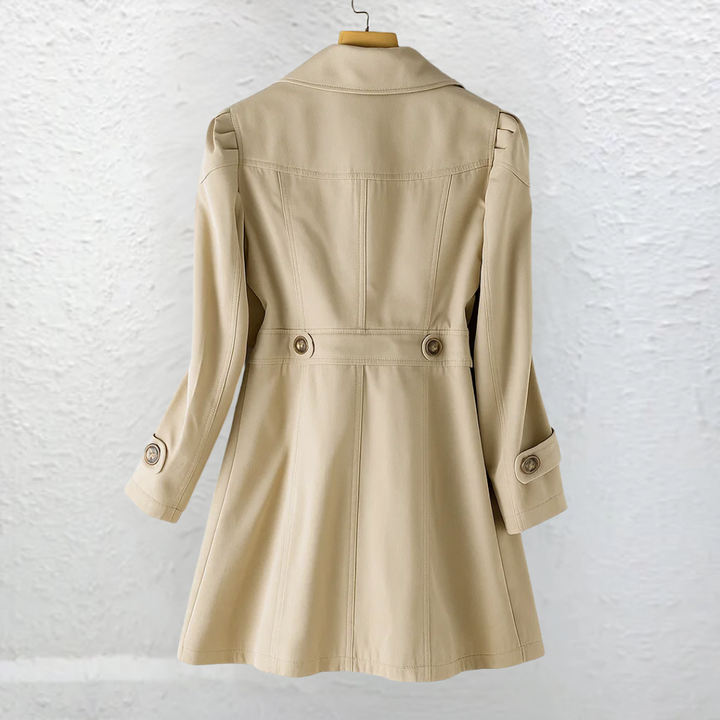 Elegant women's fitted trench coat with structured collar, versatile for workwear or chic fall and spring outfits.