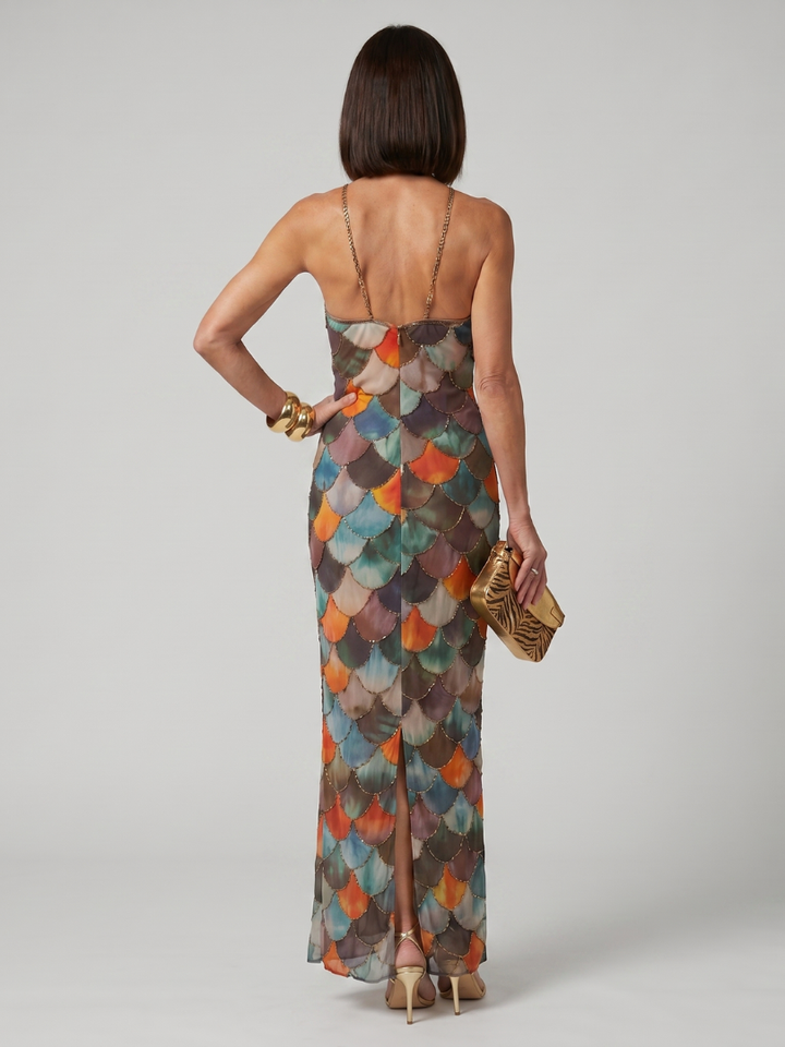 Women's fashion fitted halter maxi dress. Bold geometric print, sleeveless design. Chic summer occasion wear.