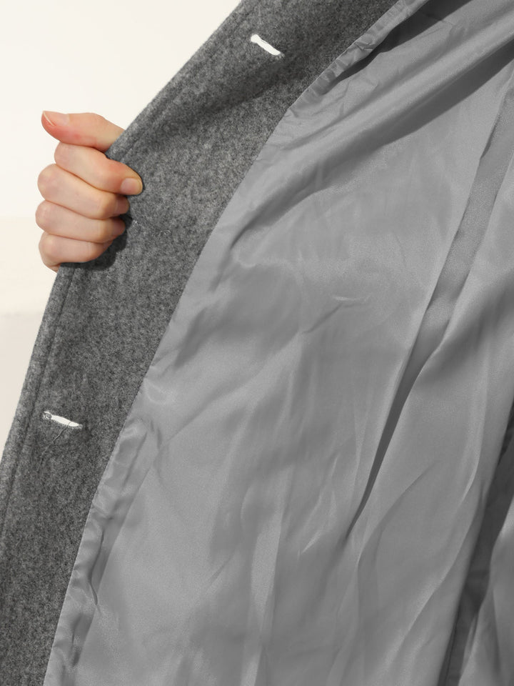 Elegant women's fall trench coat, featuring a buttoned front and structured collar, perfect for work or stylish outings.
