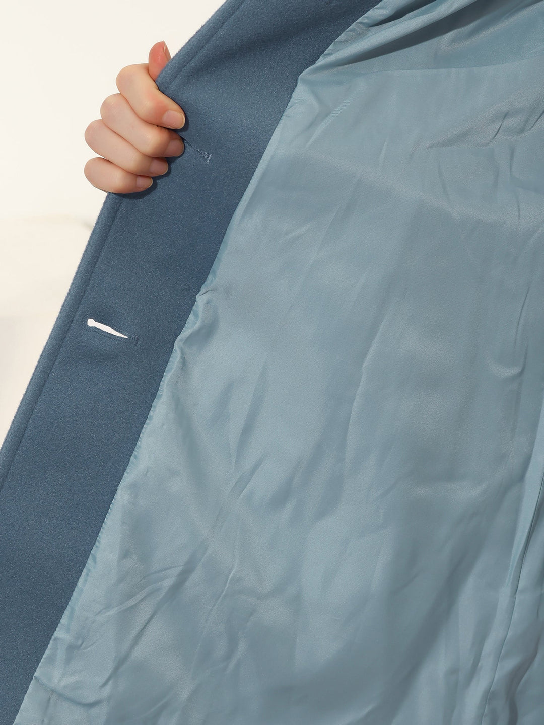 Stylish women's trench coat with a sophisticated fitted cut and full button placket, great for diverse formal occasions.
