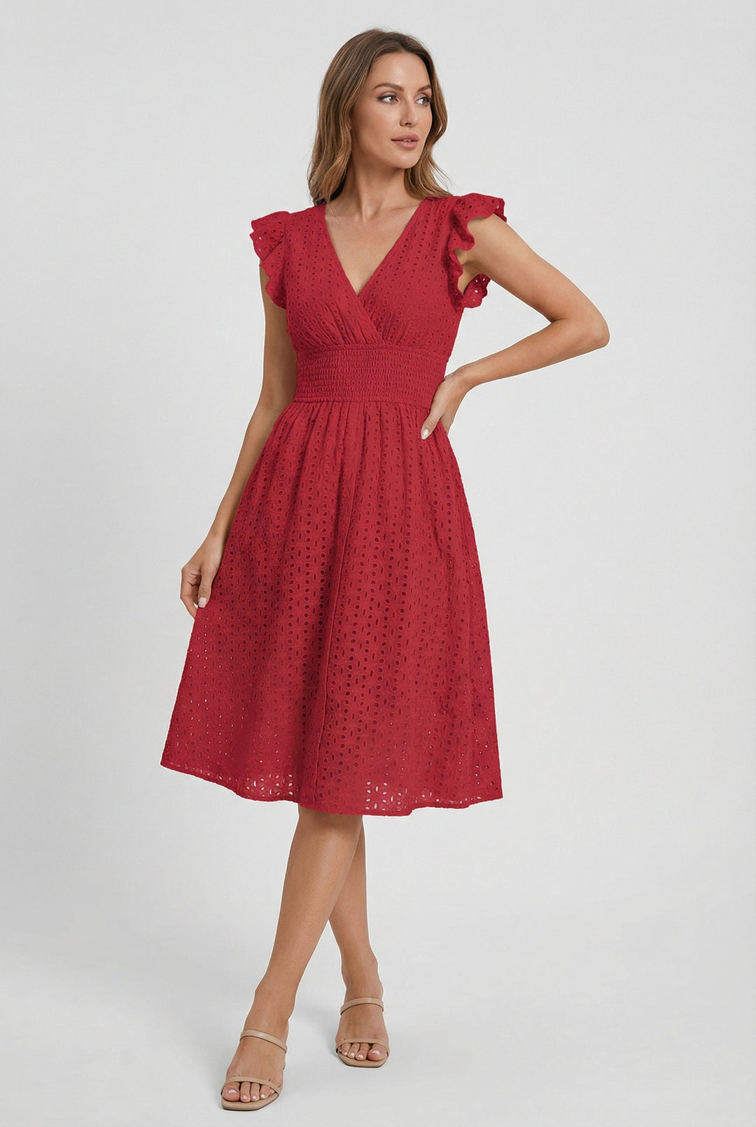 Chic eyelet women's dress, midi length with a flared skirt, smocked waist & elegant ruffled sleeves.