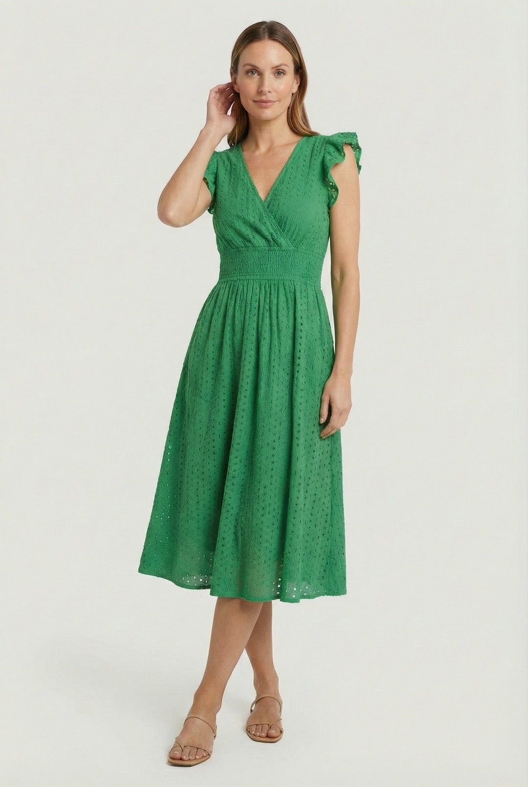 Feminine women's casual dress with eyelet details, a flared skirt, and charming ruffled sleeves.