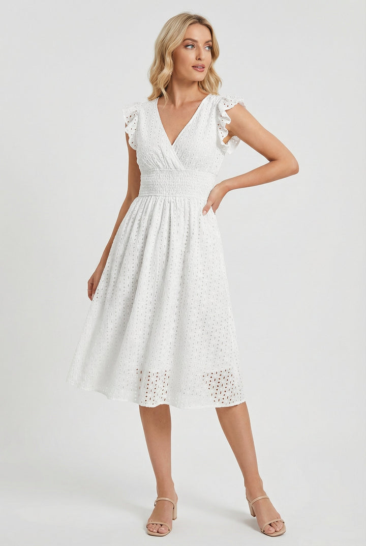 Stylish women's eyelet midi dress featuring a flattering flared skirt and charming ruffled sleeves.
