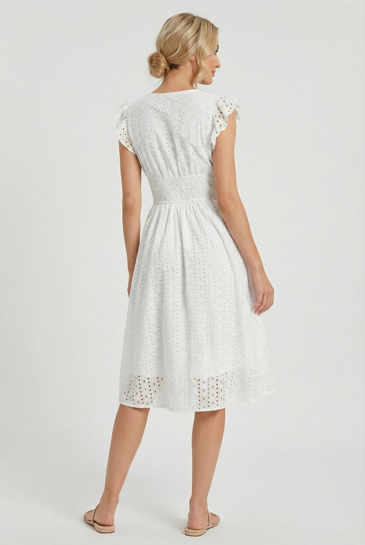 Casual women's smocked waist midi dress with intricate eyelet details and flirty ruffled sleeves.