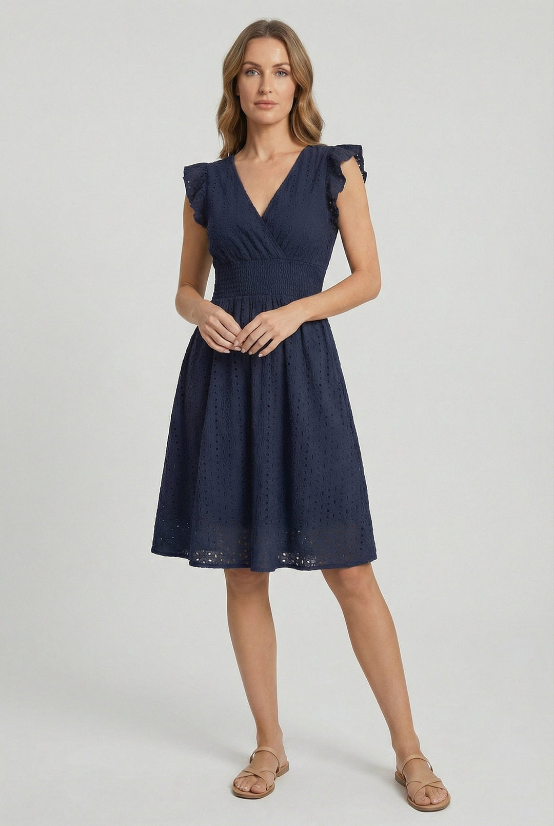 Comfortable women's beach dress, eyelet midi style with a flared skirt and pretty ruffled sleeves.