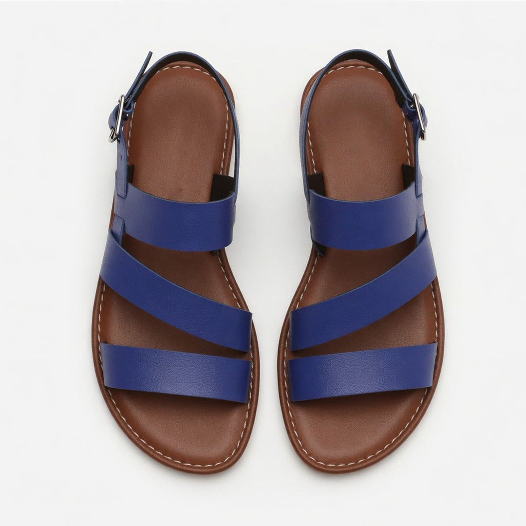 Casual women's flat sandals with stylish crossover straps, offering comfort for all-day wear.