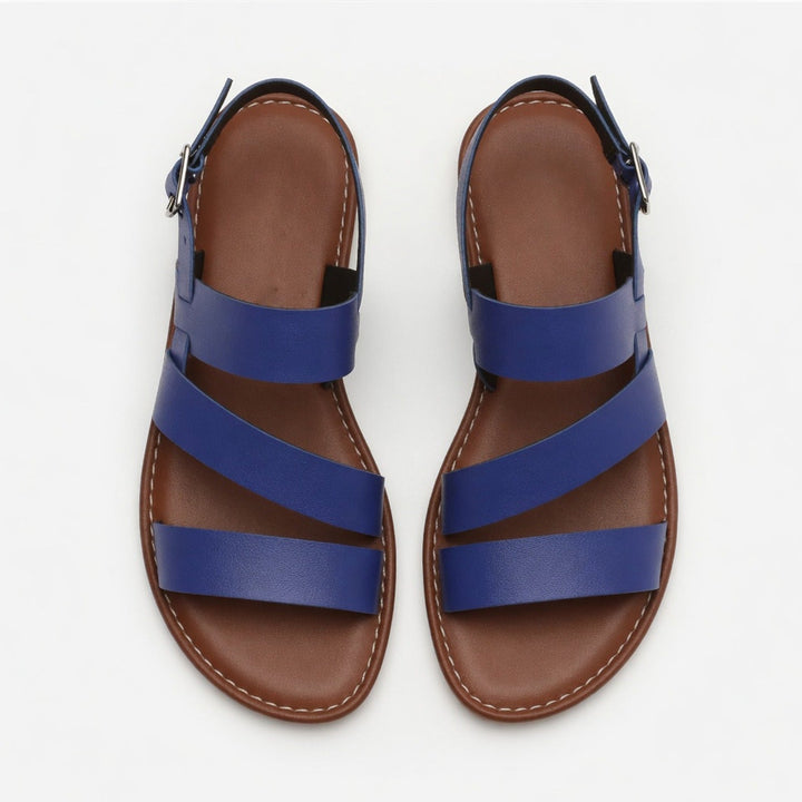 Casual women's flat sandals with stylish crossover straps, offering comfort for all-day wear.