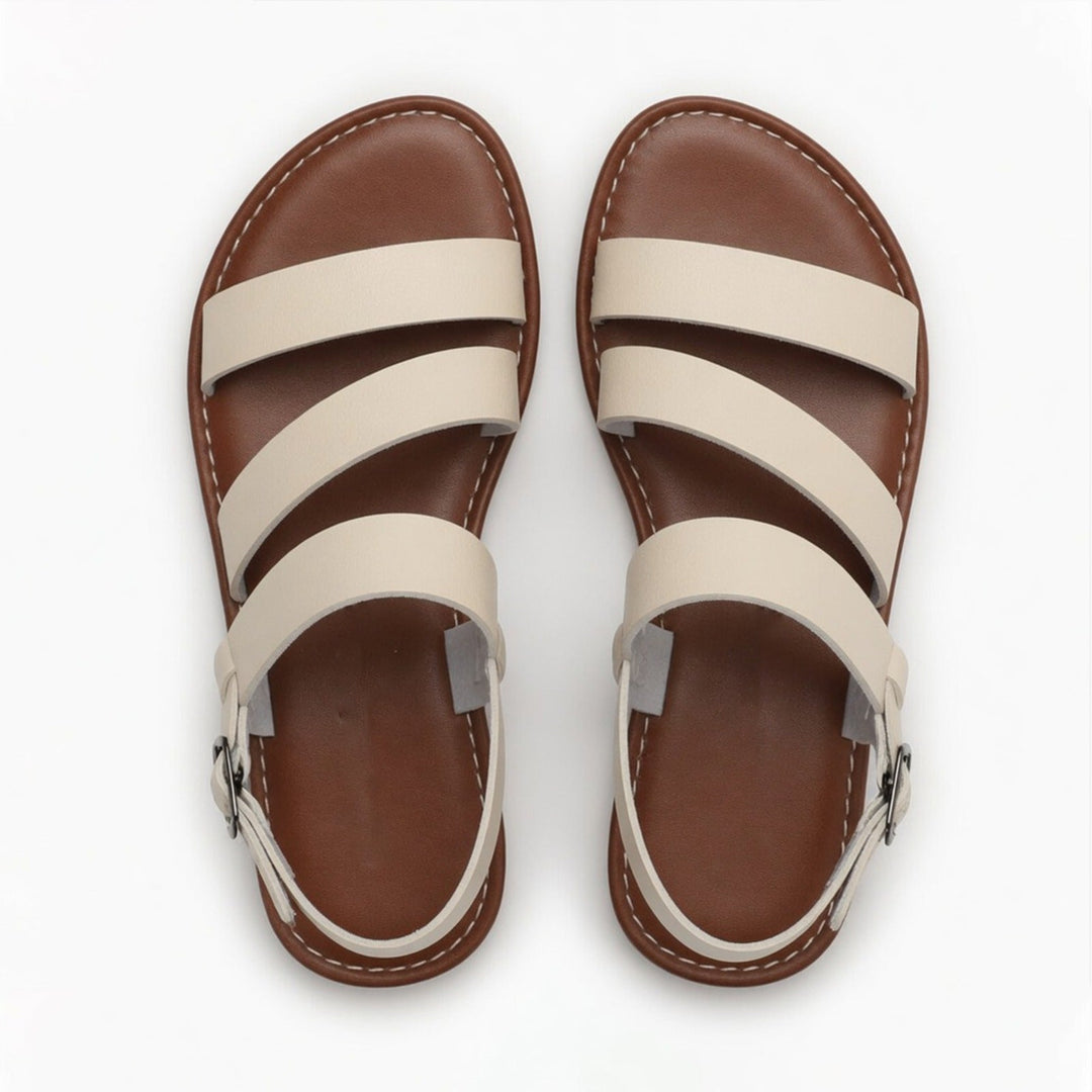 Vacation-ready women's flat sandals. Open-toe, crossover straps, and comfortable for exploring.