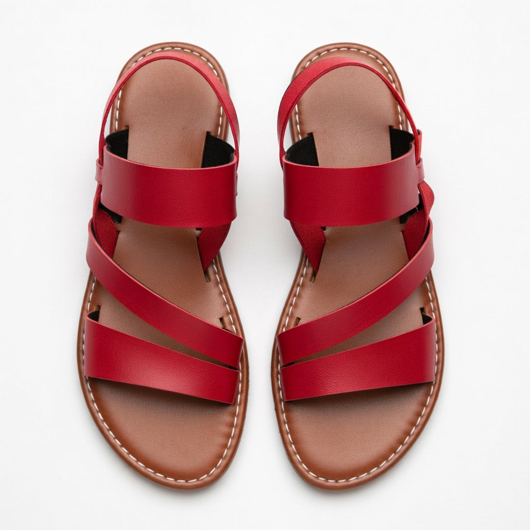 Trendy women's flat sandals featuring a comfortable open-toe design & chic crossover straps.